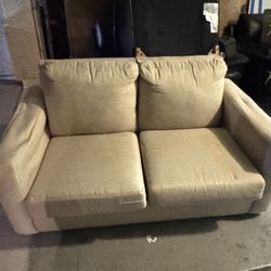 Beige loveseat couch with pull out bed