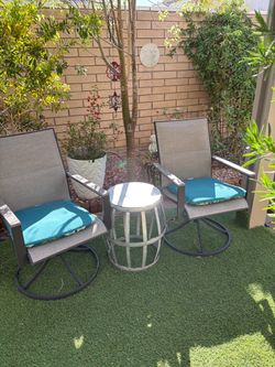 Two brand new swivel rocker chairs w cushions