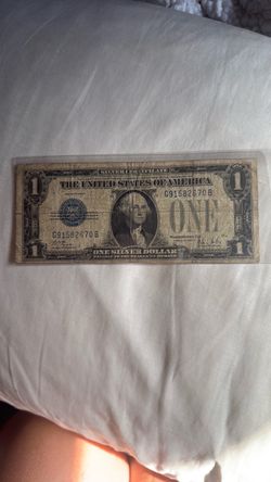 $1 Silver Certificate 1928 blue seal misaligned.
