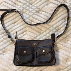 Brown, black, and gold coach purse