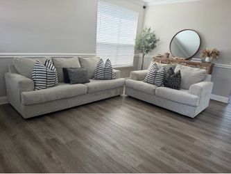Light gray sofa and loveseat set