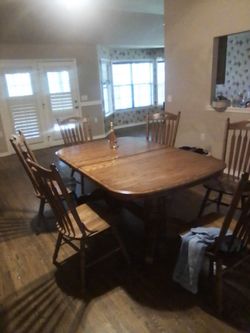 Oak dining room table with six chairs