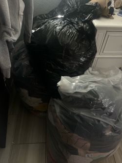 3 bags filled with clothes