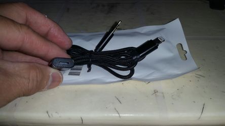 new .it is 2 in 1 cable audio and charger @ the same time