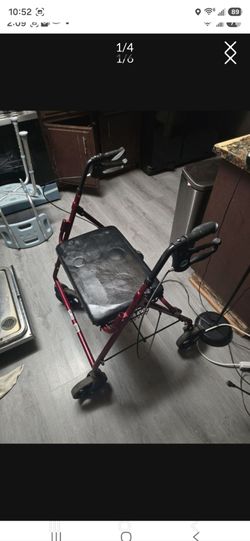 Red Rollator Walker with Seat Has a metal basket under the seat