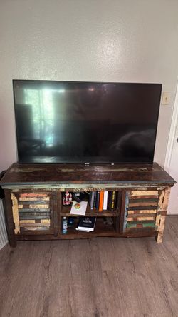 Cool rustic cabinet with 75 inch Samsung smart tv