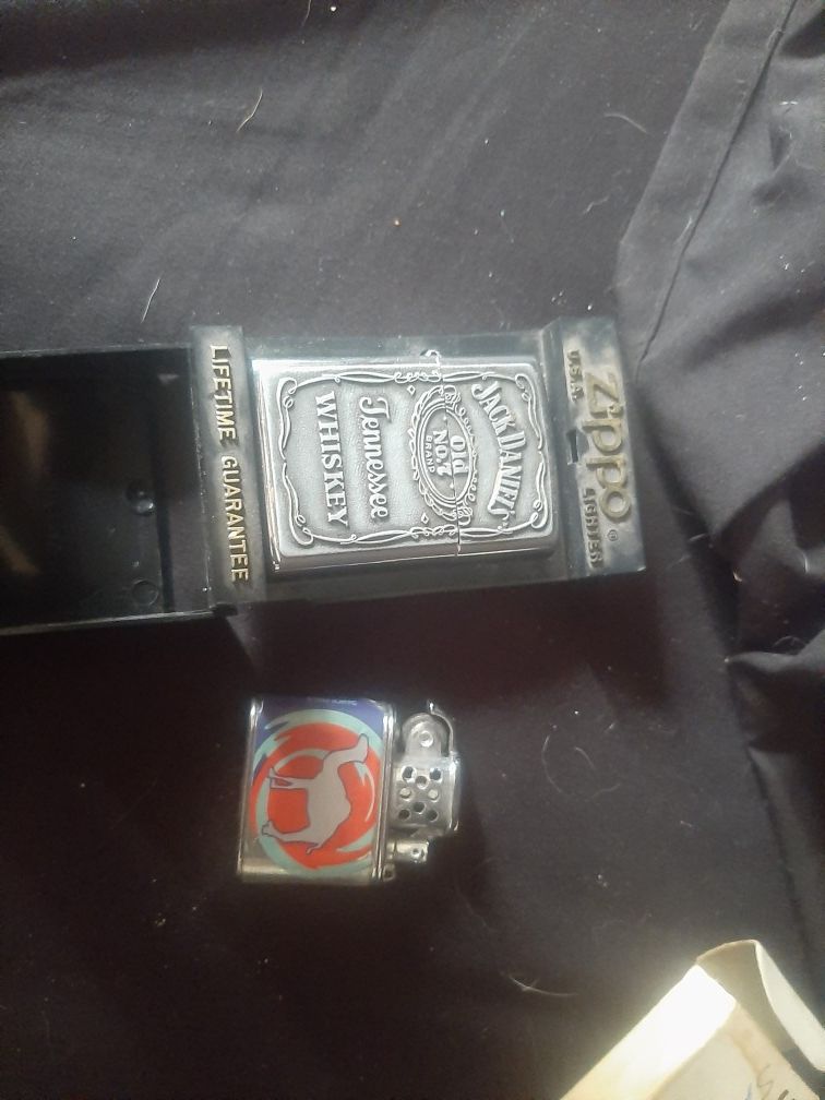 2 old zippos one Camel and the other jack daniels 40 OBO