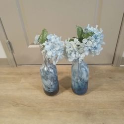 2 negotiable baby blue vases with carnations