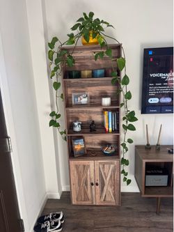 Tall bookshelf with barn-door cabinet base
