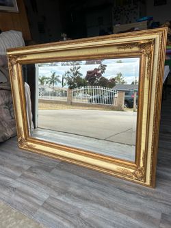 Gold trim wall mirror