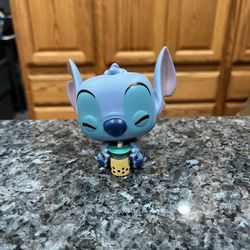 Funko Pop Disney Stitch With Boba Hot Topic Exclusive.  Preowned has been on display in a cabinet with a Disney collection.  