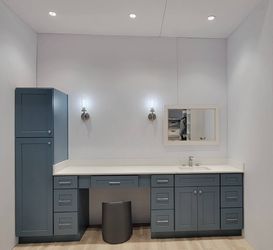 Blue cabinets bathroom and countertop