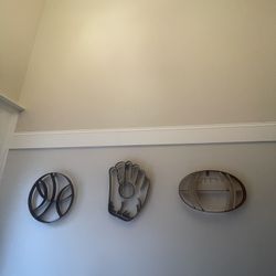 THREE WROUGHT IRON SPORTS WALL DECOR