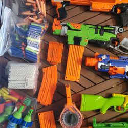 Assortment Of Nerf Guns, Water Guns, And Water Balloons 