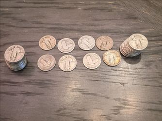 Standing silver quarter coins