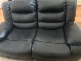 Reclining leather love seat