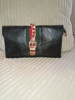 Black Clutch with Red,Green Stripe and Chain Center.