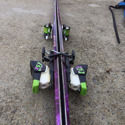 Downhill skis with poles and bag