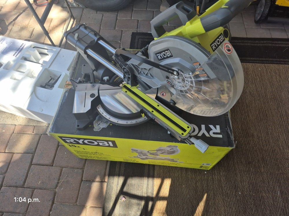 RYOBI SLAITYNNG MITER SAW 10 INCH NEW CONDITIONS 