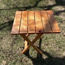 Slatted all light wood folding table small 22.5 deep- 25.25 tall- 20 wide  Has lock to make sturdy use indoor or outdoor like brand new 