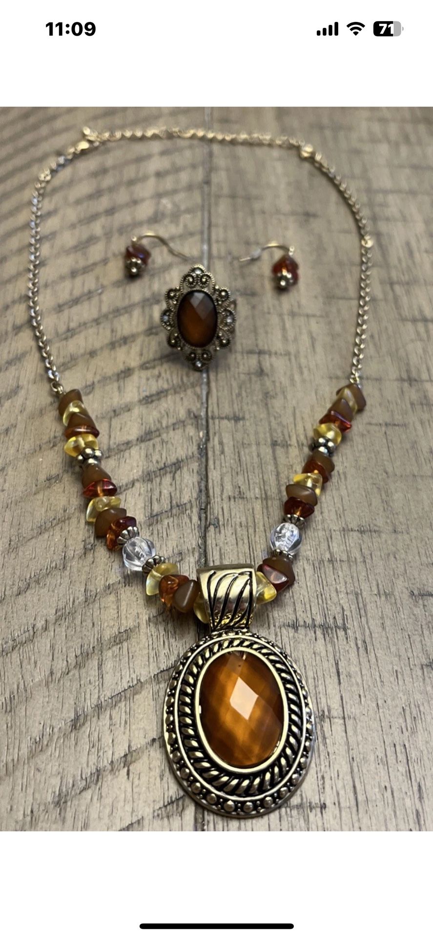 Gold toned necklace, earrings and ring set.