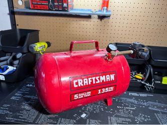 Craftsman 5-gallon portable horizontal air tank with a 135 PSI maximum pressure rating (Model #(contact info removed)0)