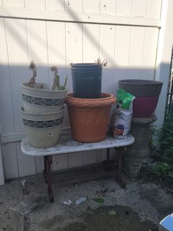 flower pots ,soil,marble table and stands
