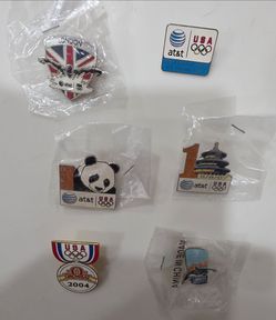 6 Olympic pins from different years (price is for all)
