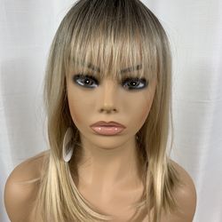Average Size Synthetic 15” Blonde With Gold Highlights, Bangs And Dark Ash Roots On The Lace Cap