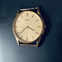 Seiko gold-tone men's watch. It is currently not working, and the hands are difficult to adjust. It