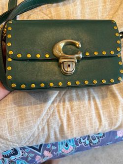 Green leather coach purse with gold accents