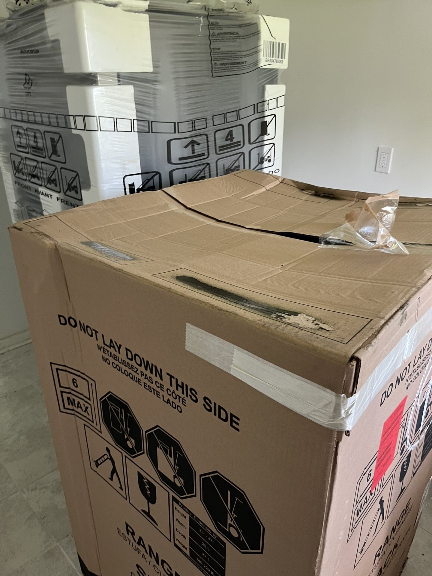 BRAND NEW STOVE AND FRIDGE IN THE BOX