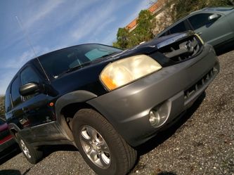 $1999 total cash price 02 Mazda Tribute