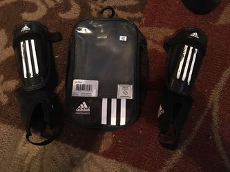 Kids adidas shin guards for playing soccer