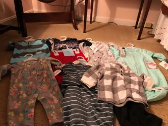 Variety of new baby clothes