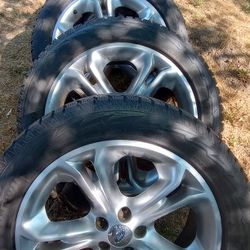 Four Tires And Rims And Lug Nuts