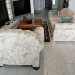 Coaches and rug and glass top table