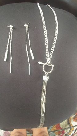 Year old Pre owned Silver/Diamond necklace w/matching earrings