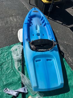 blue sit-on-top recreational kayak, closely resembling models like the Lifetime Calypso or similar compact 8-foot single-person recreational/youth kay