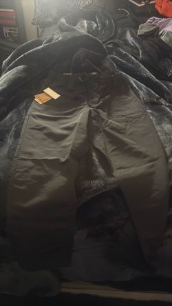 Men’s medium vans, nylon pants, loose tapered with tags