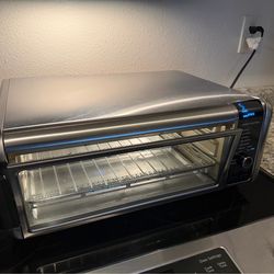 Ninja Digital Air Fryer & Toaster Oven | 8-in-1 Functionality | Flip-Up Design | XL Capacity | Air Fry Basket, Sheet Pan, Wire Rack & Crumb Tray | 180