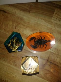Acrylic enclosed knick knacks/paper weights.