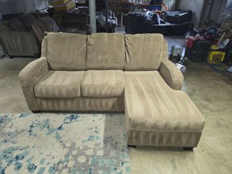 Ashley Furniture Tan with an Reversible Chaise Sectional