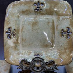 Set of (4) Beautiful handcrafted studio art pottery fleur-de-lis pattern.  salad plates. signed "CAT 06". Stoneware / clay and has a glazed finish, wi