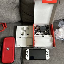 Nintendo Switch Oled with games and accessories 