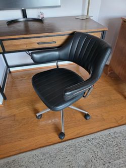 Mid-Century Modern ribbed black faux leather office chair