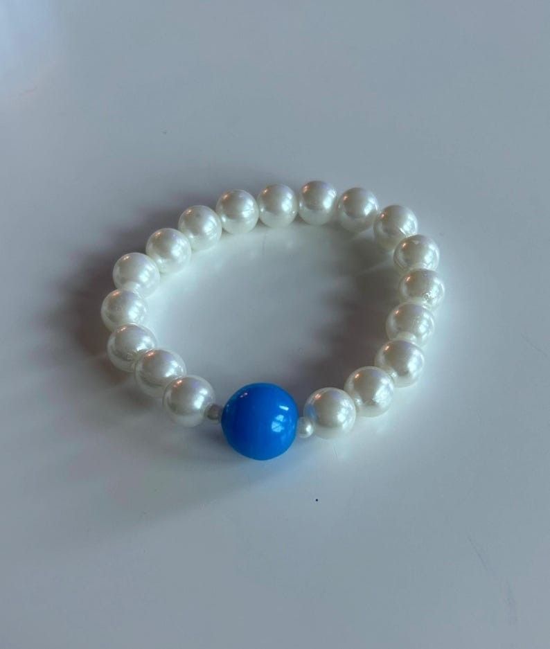 Elegant Handmade Pearl Bracelet with Blue Hope Accent Bead
