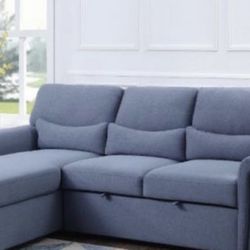 A brand new blue fabric reversible sofa sleeper sectional