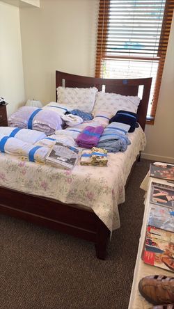 Queen Size bed with mattress, headboard and footboard.