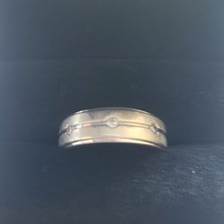 One 10 karat white gold and diamond contemporary gents wedding band